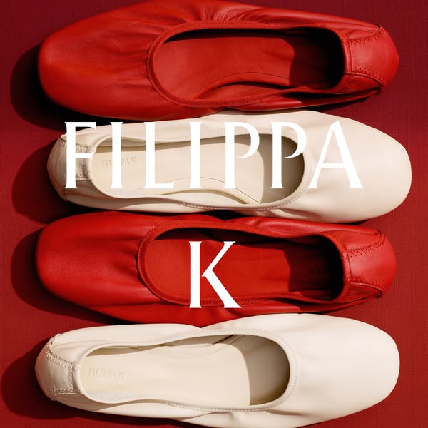 This ad features two pairs of FILIPPA K ballet flats, one red and one cream, arranged in alternating colors against a ma
