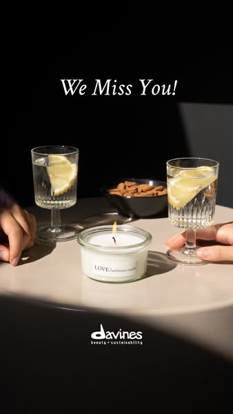 This ad emphasizes the comforting and calming effects of the Davines LOVE/ambience candle, suggesting a cozy and intimat