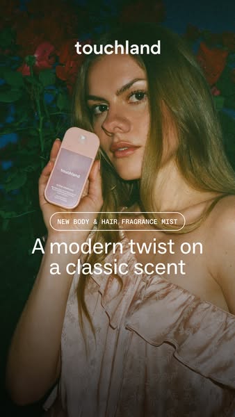 An image promoting Touchland's new body and hair fragrance mist. The ad features a woman holding the product with th