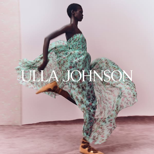 This ad features a single image of a model in motion, wearing a flowing dress by Ulla Johnson. The brand name is overlai