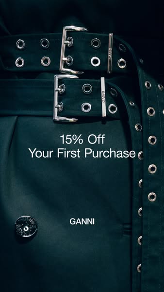 This image ad features a close-up shot of a GANNI garment, showcasing the brand's name and offering a 15% discount o