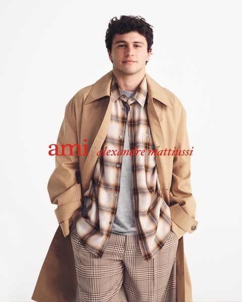 This ad features a model wearing clothing from the brand ami.