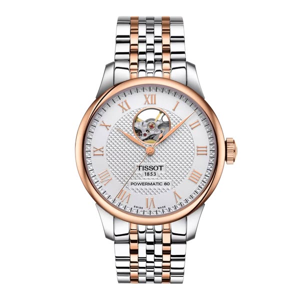This ad showcases a Tissot watch with a silver and rose gold band and a white face. The watch face has Roman numerals an