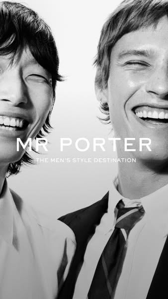 This image ad for MR PORTER features two men smiling in a black and white photo. Text overlay reads 'MR PORTER THE M