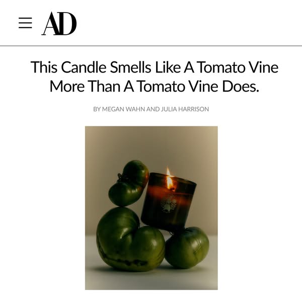 This image ad uses an image of a candle in a dark brown glass, paired with a stack of unripe tomatoes. The headline is a
