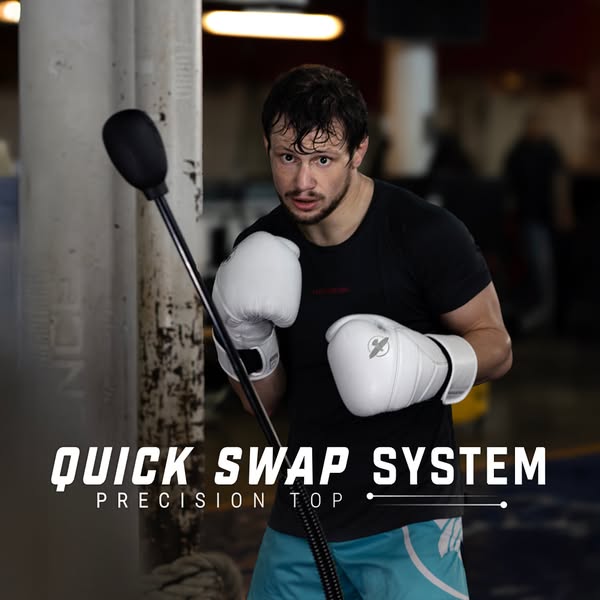 This ad is for a 'quick swap system' precision top product. The image shows a man with boxing gloves. In the bac