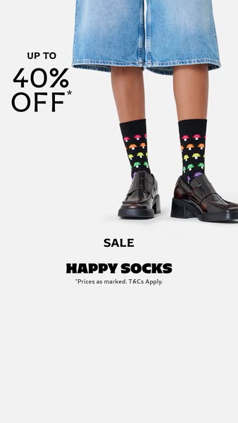 This image ad for Happy Socks features a sale of up to 40% off. The ad showcases a pair of black socks with a colorful m