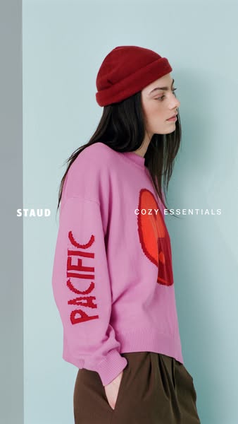 This ad showcases a pink sweater with a red design on the front and the word 'PACIFIC' down the sleeve. The ad i
