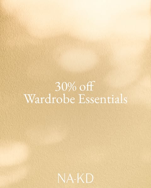 This image ad showcases a 30% discount on wardrobe essentials from NA-KD. The ad features a simple, minimalist design wi
