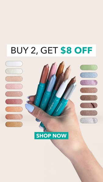 This image ad promotes eyeshadow sticks with an offer to buy two and get $8 off. The ad features a hand holding several 
