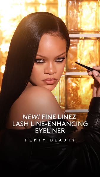 This Fenty Beauty image ad features Rihanna applying the Fine Linez Lash Line-Enhancing Eyeliner. The ad promotes the ey