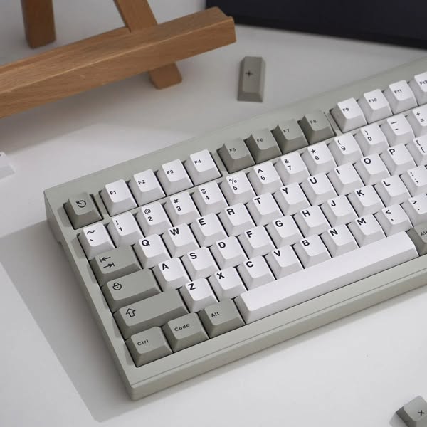 This ad showcases a mechanical keyboard with gray and white keycaps. The ad is simple and aims to appeal to keyboard ent