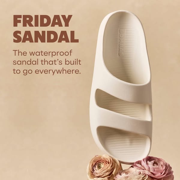 This image ad promotes the Bombas Friday Sandal. The ad features a single sandal resting on top of several flowers, and 