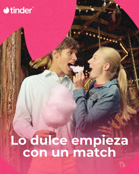 An image ad for Tinder featuring a young couple sharing cotton candy at a carnival. The ad uses the tagline "Lo dul