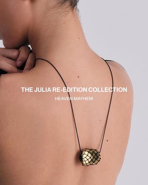 This image ad showcases a close up of a necklace from the Julia Re-Edition Collection from Heaven Mayhem. The necklace f