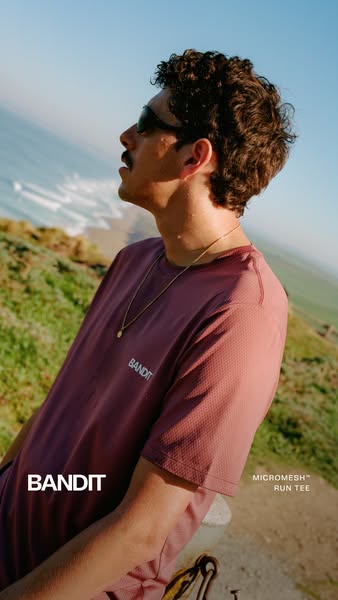 This ad for Bandit's Micromesh™ Run Tee features a man wearing the shirt while standing outside near the ocean. The 