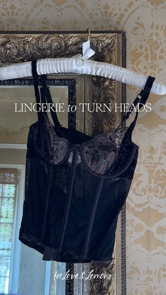 This image ad showcases a black lingerie top from For Love & Lemons, emphasizing its design and appeal.