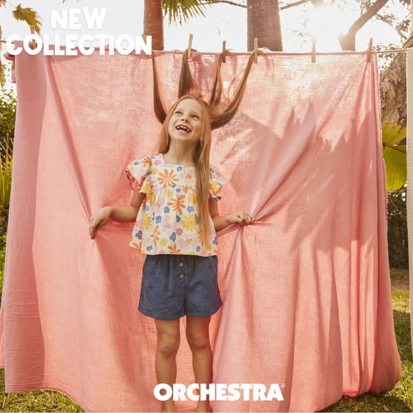 This image ad features a young girl modeling clothing from Orchestra's new collection. Set outdoors with a playful b