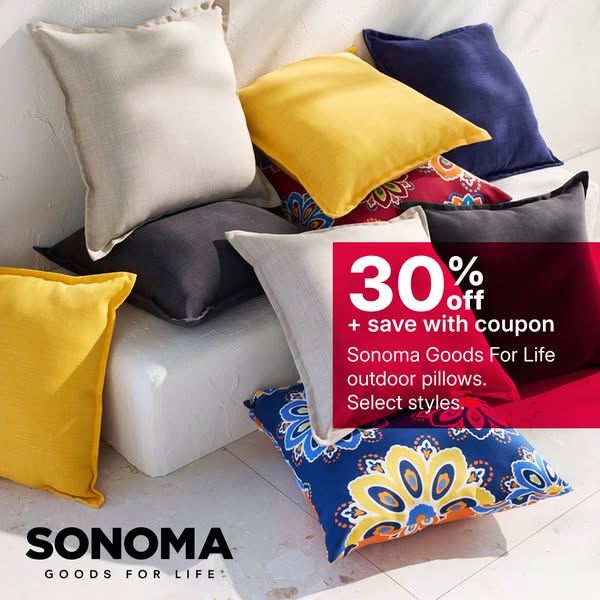 This ad for Sonoma Goods For Life features an image of several of the brand's outdoor pillows stacked and strewn acr