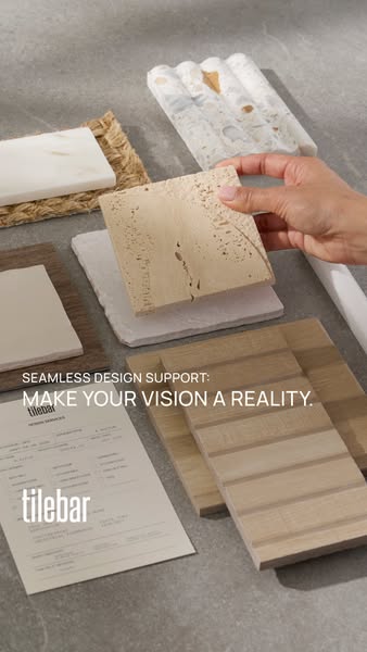 An image ad showcasing samples of Tile Bar's tile selection. A person is reaching for a tile, highlighting the compa