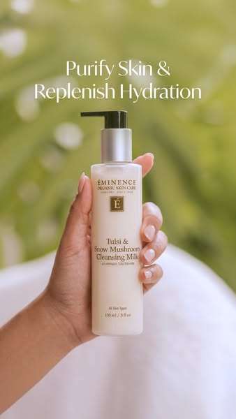 This ad showcases Éminence Organic Skin Care's Tulsi & Snow Mushroom Cleansing Milk, emphasizing its ability to 