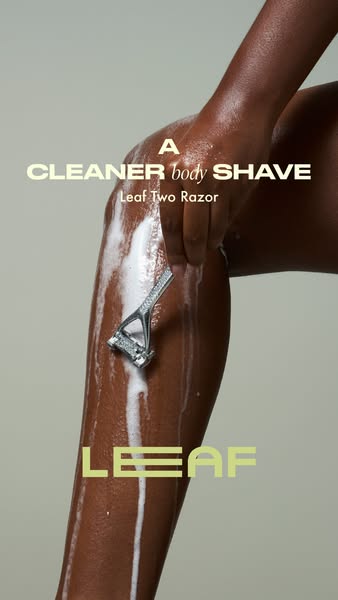 This ad features a close-up of a person using a Leaf Two Razor on their leg. The visual focuses on demonstrating the pro