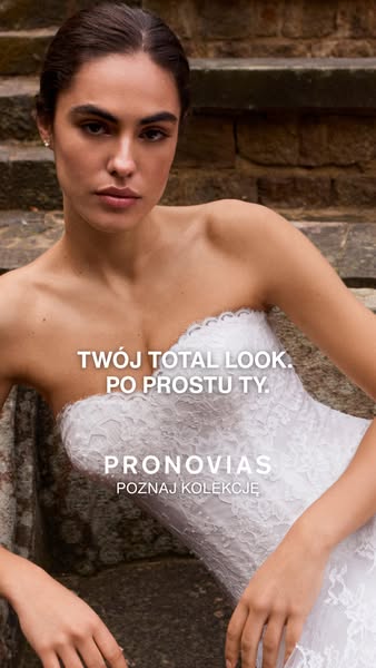 This ad for Pronovias features a model wearing a white strapless wedding dress. The text in the ad invites viewers to di