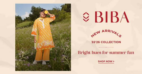 This image ad for BIBA features a young model in an orange floral printed kurta and palazzo pants standing in a grassy f