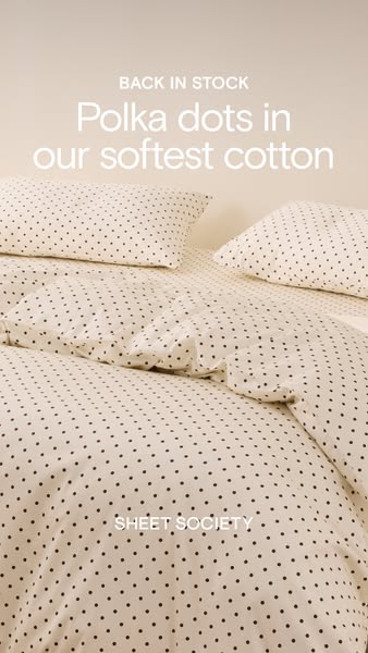 This ad features a close-up shot of a bed with polka-dot sheets, pillows, and duvet cover with the phrases "BACK IN