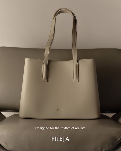 Image ad featuring a tote bag with the tagline 'Designed for the rhythm of real life'.