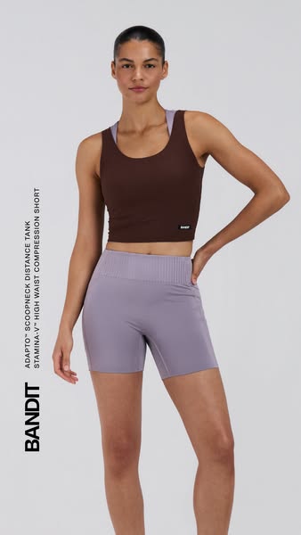 This image ad features a woman modeling workout clothing from Bandit, consisting of a brown tank top and purple high-wai