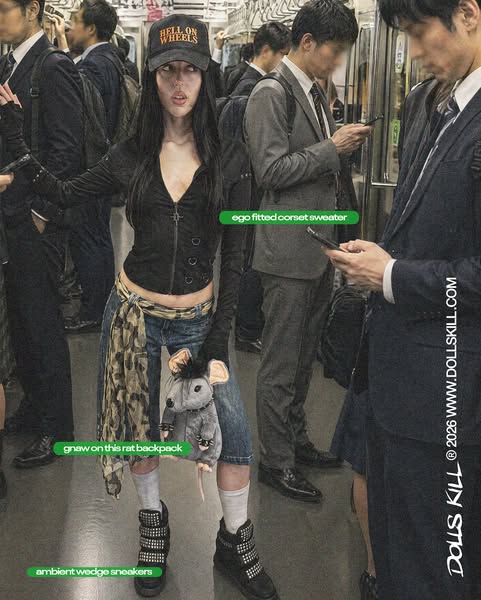 This ad from Dolls Kill features a woman wearing multiple products that are available for purchase from Dolls Kill. She
