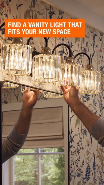 This ad for The Home Depot promotes a vanity light fixture with crystal-style shades. The ad shows someone installing th