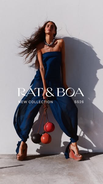 This image ad from Rat & Boa showcases a model wearing a blue jumpsuit from their SS26 collection. The ad is designe