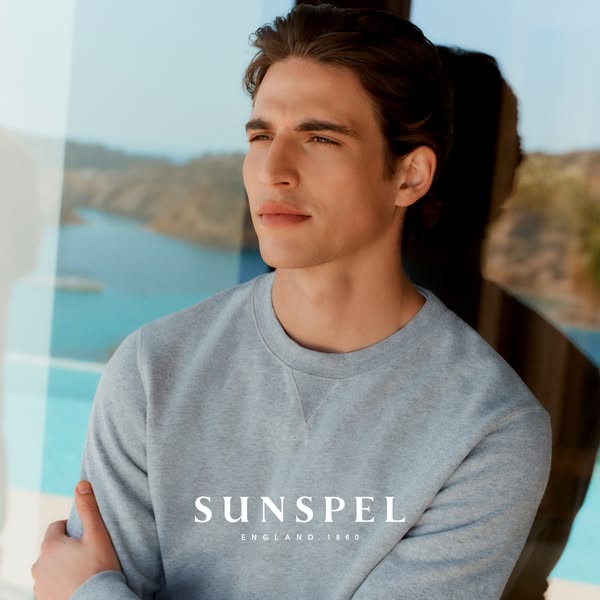 An ad showcasing the Sunspel brand and their grey sweatshirt.