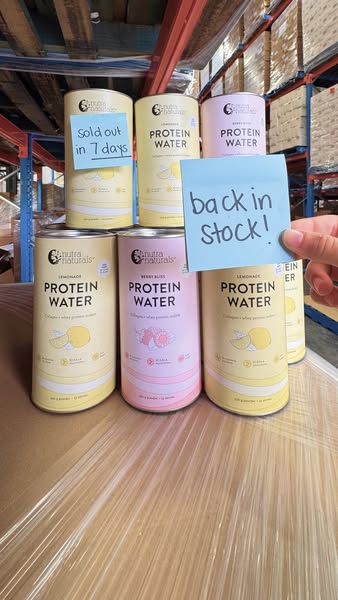 A product snapshot featuring protein water containers from the brand Nutra Naturals. Several containers of the product a
