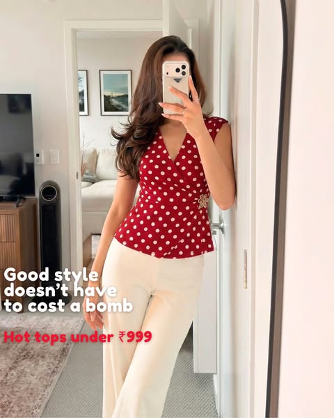 This ad features a woman taking a mirror selfie to advertise hot tops for under ₹999.