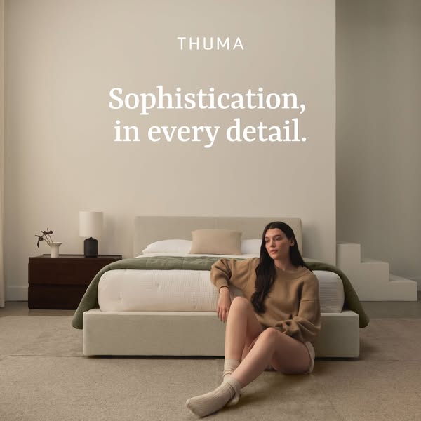 This image ad for Thuma focuses on sophisticated design and comfort, showcasing a serene bedroom setting with a woman re