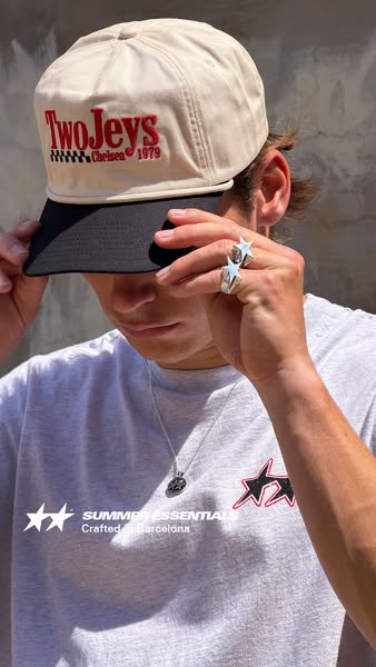 This ad promotes TwoJeys brand products through a model wearing the brand's hat and t-shirt.