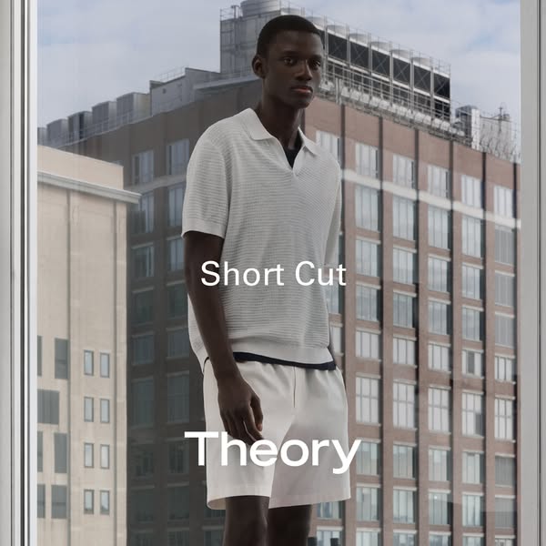 This image ad features a dark-skinned male model wearing Theory brand polo shirt and shorts. The ad aims to showcase the