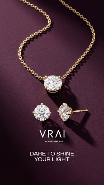 This image ad showcases Vrai jewelry. The ad features a diamond necklace and earrings set against a dark purple backgrou