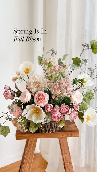 The ad showcases a handcrafted floral arrangement as the central product. The ad is styled for a spring theme and is lik