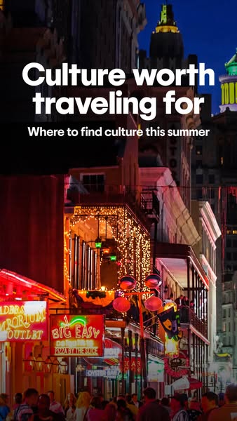 This image ad promotes travel to experience culture this summer, featuring a vibrant street scene at night with restaura