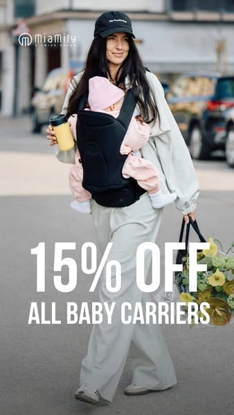 This image ad for Miamily features a woman wearing the brand's baby carrier while walking on the street. The ad prom