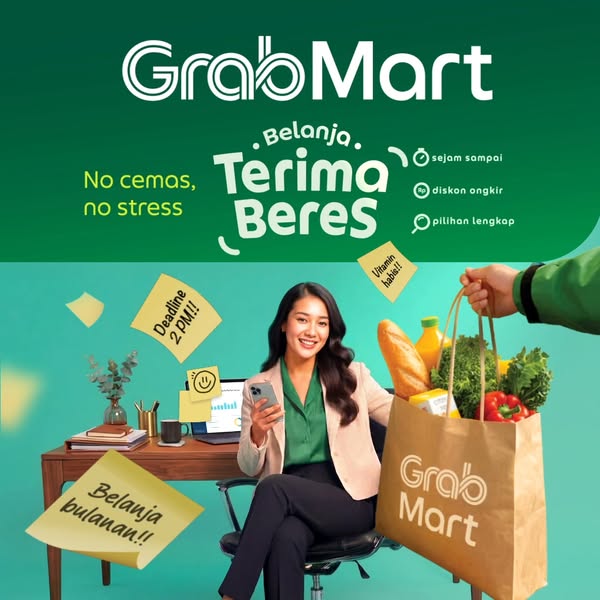 This image ad for GrabMart features a woman working at a desk, with post-it notes displaying deadlines and grocery needs