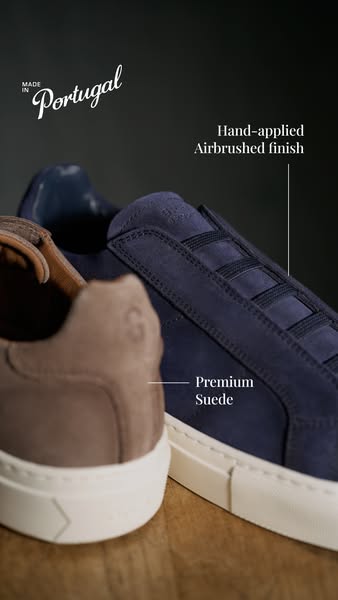 This ad showcases the features of a pair of premium suede shoes, highlighting their hand-applied airbrushed finish and t
