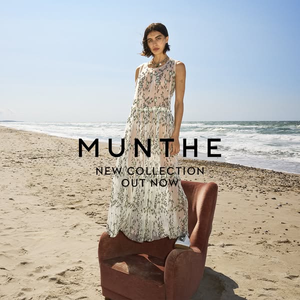 This ad showcases a model on a beach wearing a flowing dress from Munthe's new collection. The scene is set with an 