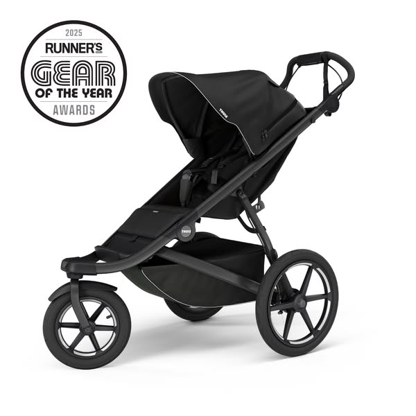 This is an image ad for the Thule brand featuring their jogging stroller. The ad showcases the stroller against a white 