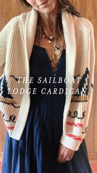 This image ad features a woman wearing a "Sailboat Lodge Cardigan" sweater. The shot is a close-up, focusing o
