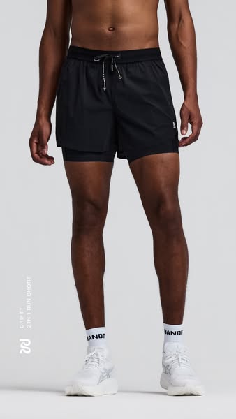 The ad features a bare-chested African American man wearing the advertised black running shorts. The shot is from the kn